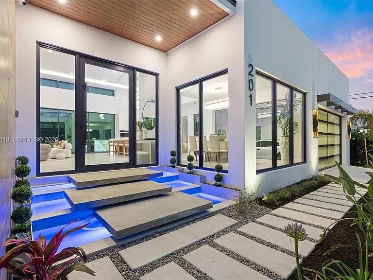 Modern home entry with floating lit steps